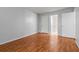 Bedroom with hardwood floors and access to bathroom at 14323 Hanging Moss Cir # 102, Tampa, FL 33613