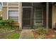 Private condo entrance with screened porch and walkway at 14323 Hanging Moss Cir # 102, Tampa, FL 33613