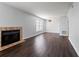 Spacious living room with fireplace and dark laminate floors at 14323 Hanging Moss Cir # 102, Tampa, FL 33613