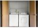 Condo laundry closet with washer and dryer included at 14323 Hanging Moss Cir # 102, Tampa, FL 33613
