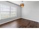 Bright dining room with hardwood floors and a chandelier at 14323 Hanging Moss Cir # 102, Tampa, FL 33613
