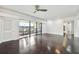 Bright living room with hardwood floors and balcony access at 36750 Us Highway 19 N # 04208, Palm Harbor, FL 34684