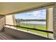 Balcony view of a lake and lush green landscape at 36750 Us Highway 19 N # 04208, Palm Harbor, FL 34684