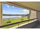 Balcony view of a lake and lush green landscape at 36750 Us Highway 19 N # 04208, Palm Harbor, FL 34684
