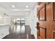 Bright condo entryway with hardwood floors and view to living room at 36750 Us Highway 19 N # 04208, Palm Harbor, FL 34684