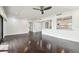 Living room with dark hardwood floors and ceiling fan at 36750 Us Highway 19 N # 04208, Palm Harbor, FL 34684