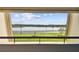 Balcony view of a lake and lush green landscape at 36750 Us Highway 19 N # 04208, Palm Harbor, FL 34684