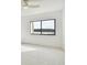 Bright bedroom featuring a large window with water views at 36750 Us Highway 19 N # 04208, Palm Harbor, FL 34684