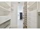 Large walk-in closet with ample storage and shelving at 36750 Us Highway 19 N # 04208, Palm Harbor, FL 34684