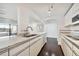 Bright kitchen with granite counters, track lighting, and dark hardwood floors at 36750 Us Highway 19 N # 04208, Palm Harbor, FL 34684