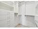 Large walk-in closet with custom shelving and drawers at 36750 Us Highway 19 N # 04208, Palm Harbor, FL 34684