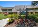 Pine Valley Lodge building entrance with landscaping and signage at 36750 Us Highway 19 N # 19206, Palm Harbor, FL 34684