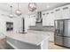 Modern kitchen with stainless steel appliances and large island at 913 Buckhurst Dr, Spring Hill, FL 34609