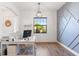 Home office features a desk, window, and stylish wall design at 913 Buckhurst Dr, Spring Hill, FL 34609
