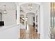 Bright and spacious entry hall with hardwood floors and elegant light fixtures at 913 Buckhurst Dr, Spring Hill, FL 34609