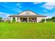 Beautiful house exterior with large backyard and covered patio at 913 Buckhurst Dr, Spring Hill, FL 34609