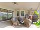 Spacious covered patio with wicker furniture, perfect for relaxing at 913 Buckhurst Dr, Spring Hill, FL 34609