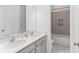 Double vanity bathroom with a shower at 913 Buckhurst Dr, Spring Hill, FL 34609