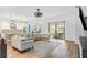 Open living area with sectional sofa and access to backyard at 913 Buckhurst Dr, Spring Hill, FL 34609