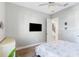 Bedroom with a queen bed, dresser, and access to stairs at 913 Buckhurst Dr, Spring Hill, FL 34609