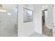Bathroom with a large walk-in shower and adjacent closet at 913 Buckhurst Dr, Spring Hill, FL 34609