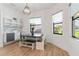 Bright breakfast nook with built-in bench seating and farmhouse table at 913 Buckhurst Dr, Spring Hill, FL 34609