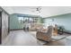 Spacious bonus room with sectional sofa and large windows at 913 Buckhurst Dr, Spring Hill, FL 34609
