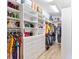 Large walk-in closet with ample shelving and hanging space at 913 Buckhurst Dr, Spring Hill, FL 34609
