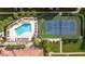 Aerial view of community pool, tennis court, and shuffleboard at 10764 70Th Ave # 3305, Seminole, FL 33772