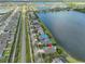 Wide aerial view of neighborhood and lake, highlighting home location at 805 Seminole Sky Dr, Ruskin, FL 33570