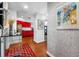 Bright entryway with red accents and hardwood floors leading to kitchen at 1 Beach Se Dr # 2007, St Petersburg, FL 33701