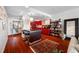 Open concept living area with hardwood floors, modern decor, and kitchen access at 1 Beach Se Dr # 2007, St Petersburg, FL 33701