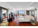 Spacious living area featuring hardwood floors and stunning city views from large windows at 1 Beach Se Dr # 2007, St Petersburg, FL 33701