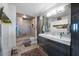 Modern bathroom with double vanity, walk-in shower, and updated fixtures at 1 Beach Se Dr # 2007, St Petersburg, FL 33701