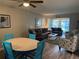 Living room with grey sofas, wood-look floors, and a coastal decor theme at 1100 E Bay Dr # 42, Largo, FL 33770