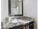 Modern bathroom sink vanity with granite countertop and dark brown cabinets at 3910 Oldbrook Ln, Plant City, FL 33566