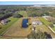 Home on a large lot with pond and outbuildings at 3910 Oldbrook Ln, Plant City, FL 33566