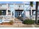 Light blue exterior of home with white railings and walkway at 3825 Pompano Se Dr, St Petersburg, FL 33705