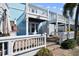 Light blue exterior of home with white railings and walkway at 3825 Pompano Se Dr, St Petersburg, FL 33705