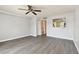 Living room with grey walls and vinyl plank flooring at 3825 Pompano Se Dr, St Petersburg, FL 33705