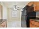 Kitchen with wood cabinets, black appliances, and a breakfast nook at 3825 Pompano Se Dr, St Petersburg, FL 33705
