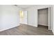 Bright bedroom with wood-look floors and spacious closet at 3825 Pompano Se Dr, St Petersburg, FL 33705