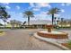 Community fountain with brick border and landscaping at 3825 Pompano Se Dr, St Petersburg, FL 33705