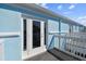 Private balcony access from light blue building exterior at 3825 Pompano Se Dr, St Petersburg, FL 33705