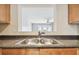 Stainless steel double sink with granite countertop at 3825 Pompano Se Dr, St Petersburg, FL 33705