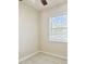 Bright bedroom with window and tile floor at 3825 Pompano Se Dr, St Petersburg, FL 33705