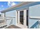 Private balcony access from light blue building exterior at 3825 Pompano Se Dr, St Petersburg, FL 33705