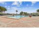 Inviting community pool with brick patio and lounge chairs at 3825 Pompano Se Dr, St Petersburg, FL 33705