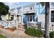 Light blue exterior of home with white railings and walkway at 3825 Pompano Se Dr, St Petersburg, FL 33705