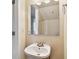 Small bathroom with a white sink and mirror at 3825 Pompano Se Dr, St Petersburg, FL 33705